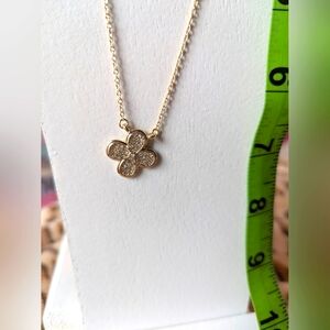 Four petal faux diamond and pave gold flower necklace. Adjustable